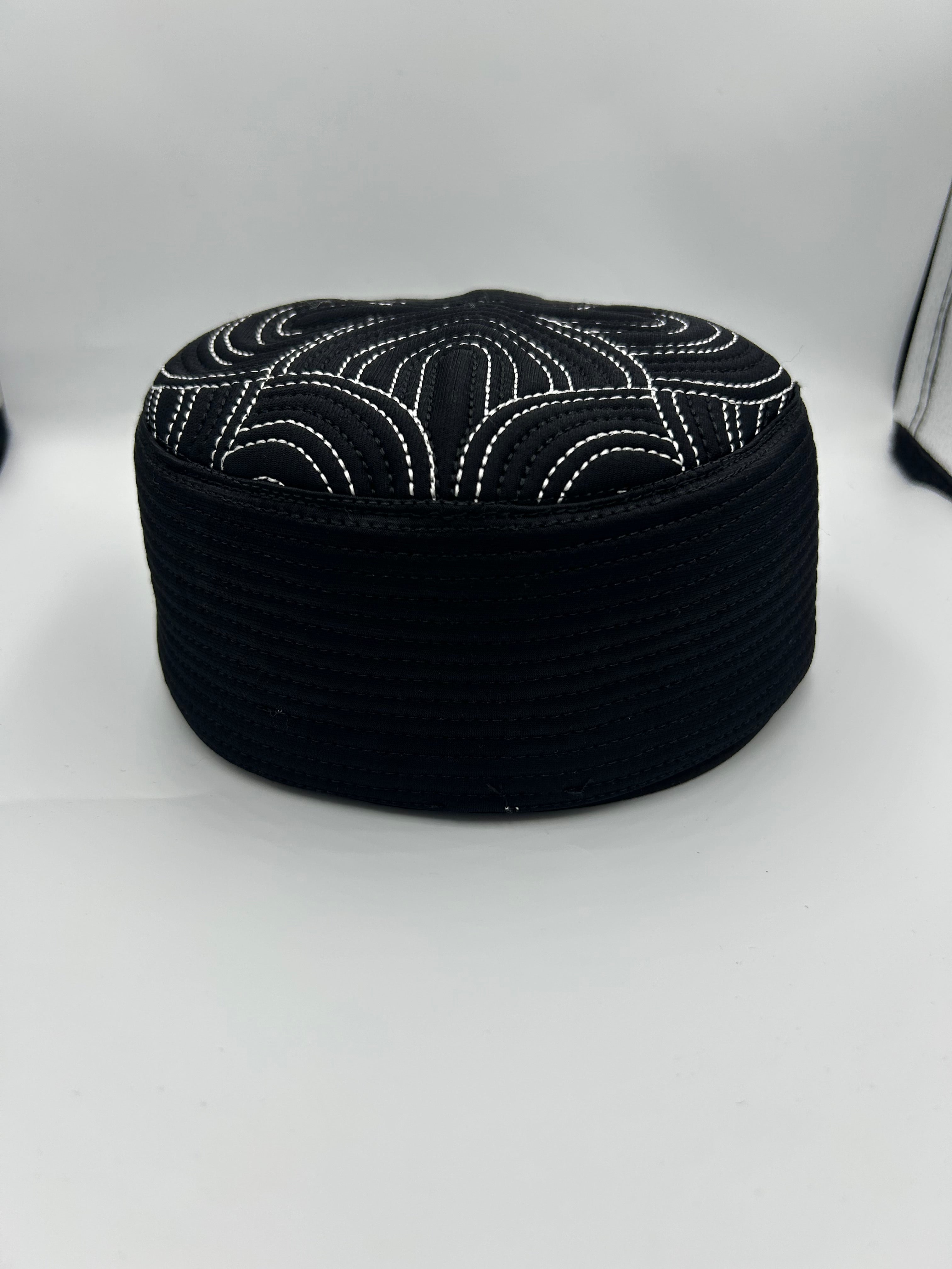 Semi hard black hat with  white design