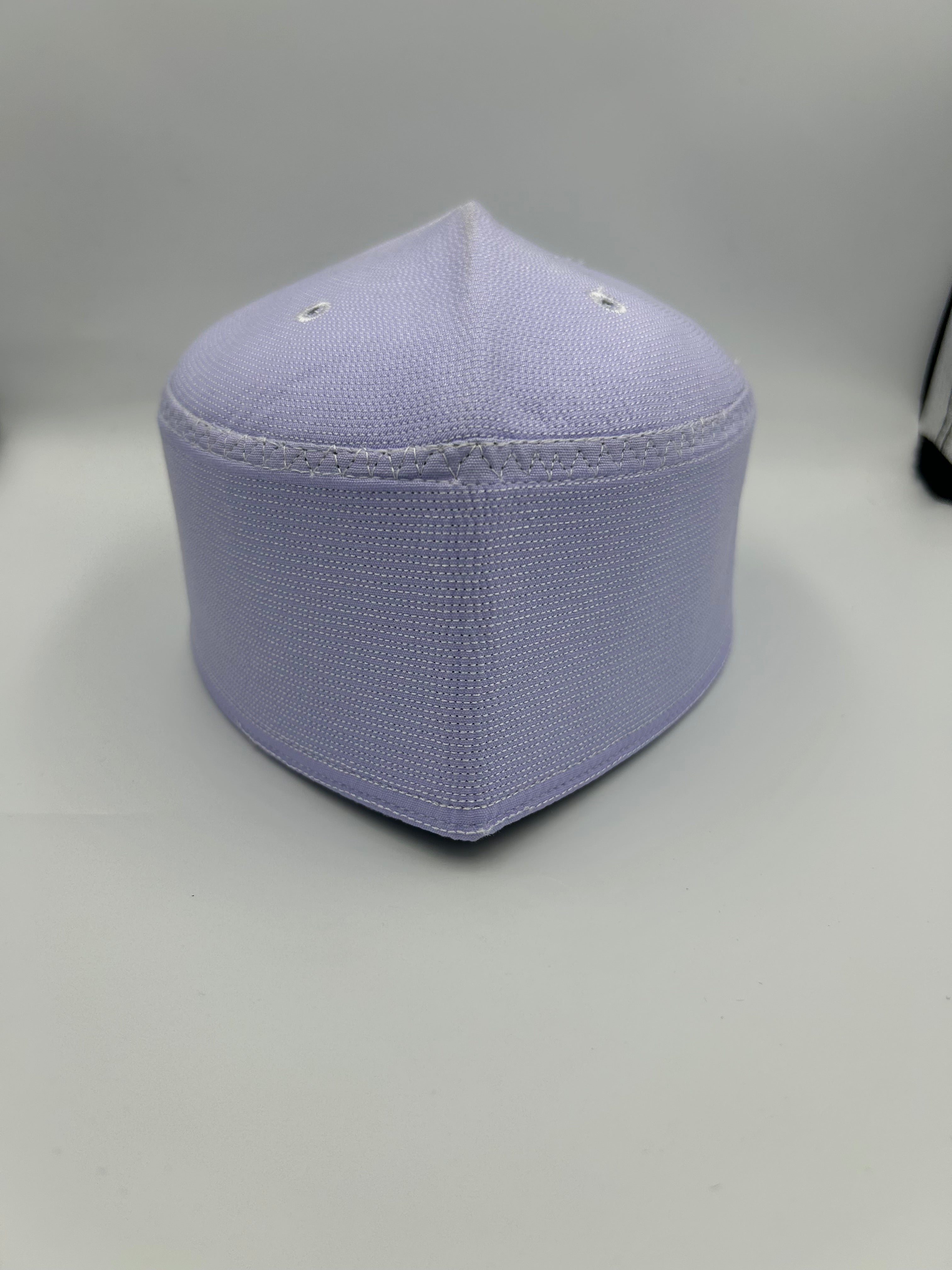 White Indonesian Hat with holes on the the top