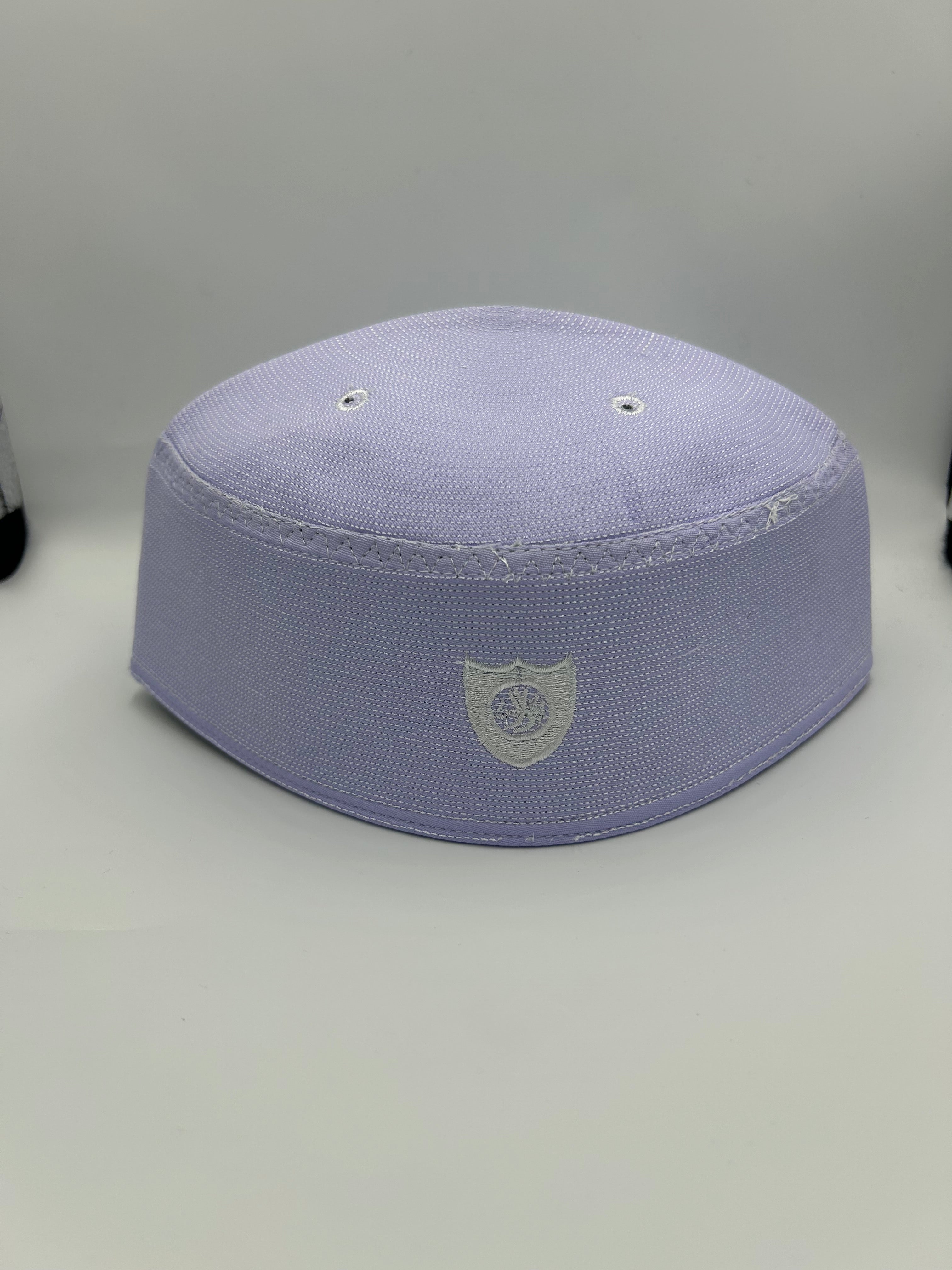 White Indonesian Hat with holes on the the top